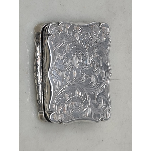 117 - A Victorian silver Vinaigrette, scroll engraved, Birmingham 1851, maker: D.P