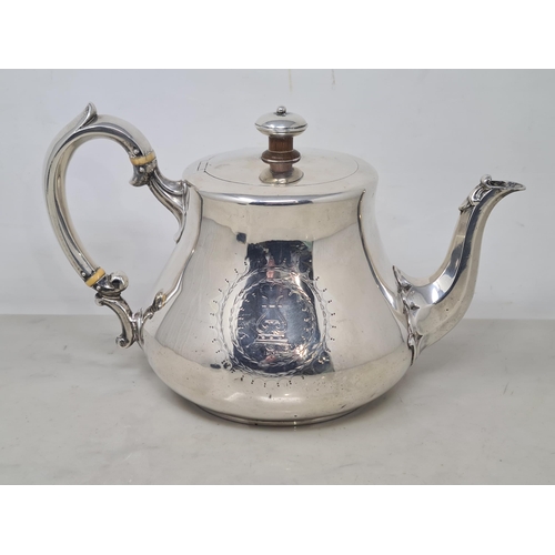 63 - A Victorian silver teapot of bellied form engraved lyre crest and initials within circular cartouche... 