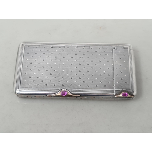 64 - A Russian silver Faberge style combined Cigarette and Vesta Case with engine turned and dot decorati... 