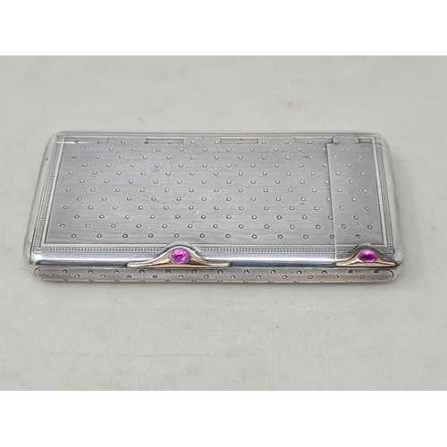 64 - A Russian silver Faberge style combined Cigarette and Vesta Case with engine turned and dot decorati... 