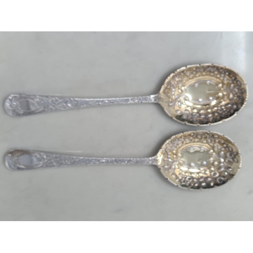 66 - A pair of Edward VII silver and parcel-gilt Fruit Spoons with floral decorated bowls and stems, Lond... 