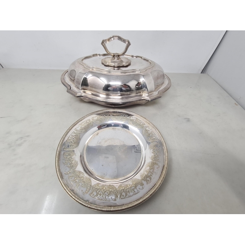 74 - A plated oval Entree Dish and Cover and a plated circular Dish