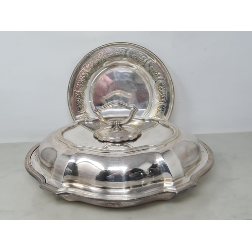 74 - A plated oval Entree Dish and Cover and a plated circular Dish