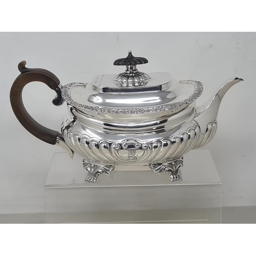 75 - An Edward VII silver three piece Tea Service of boat shape with gadroon embossing, floral border, en... 