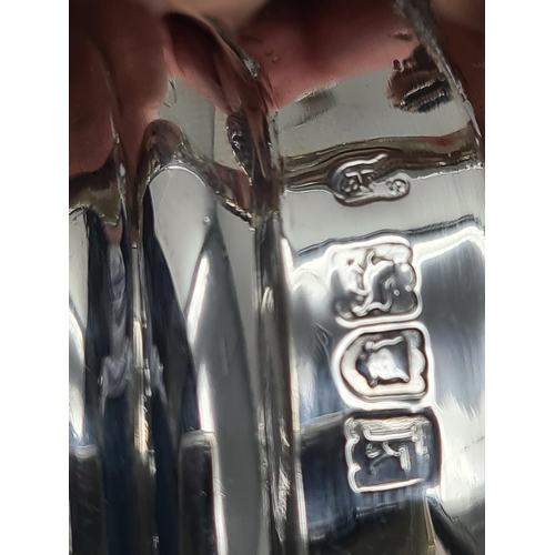 75 - An Edward VII silver three piece Tea Service of boat shape with gadroon embossing, floral border, en... 