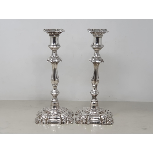 76 - A pair of Edward VII silver Table Candlesticks with knopped stems on shaped square bases, Birmingham... 