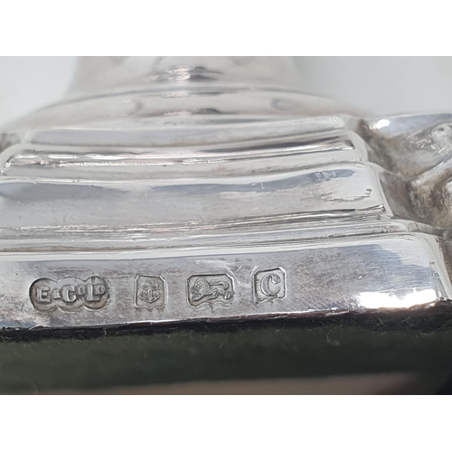 76 - A pair of Edward VII silver Table Candlesticks with knopped stems on shaped square bases, Birmingham... 