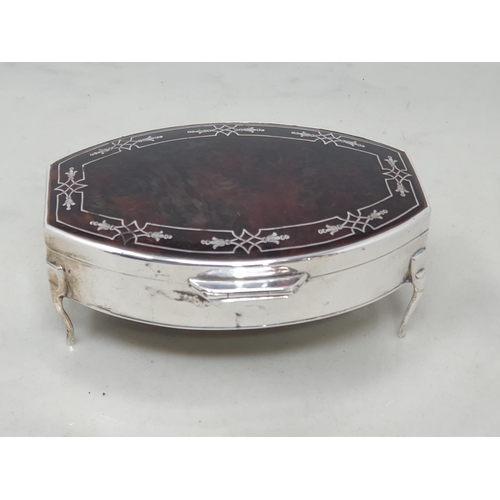 79 - A George V silver and tortoiseshell Trinket Box with inlaid frieze on four shaped supports, Birmingh... 