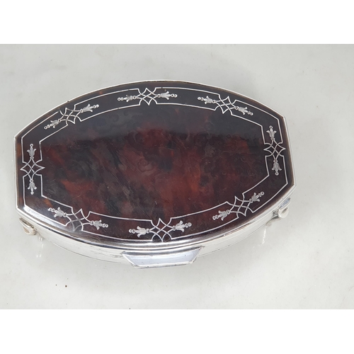 79 - A George V silver and tortoiseshell Trinket Box with inlaid frieze on four shaped supports, Birmingh... 