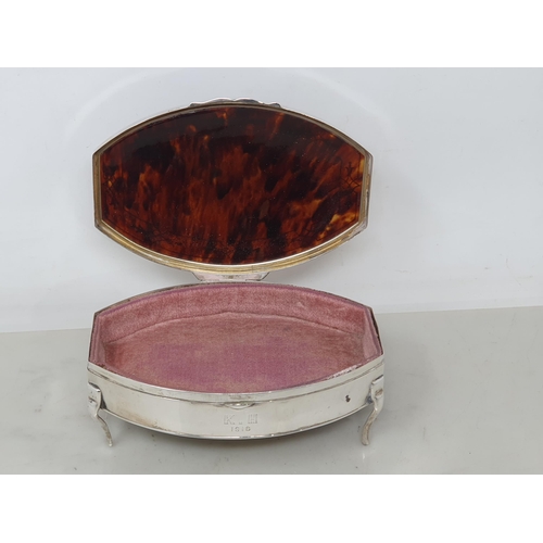 79 - A George V silver and tortoiseshell Trinket Box with inlaid frieze on four shaped supports, Birmingh... 