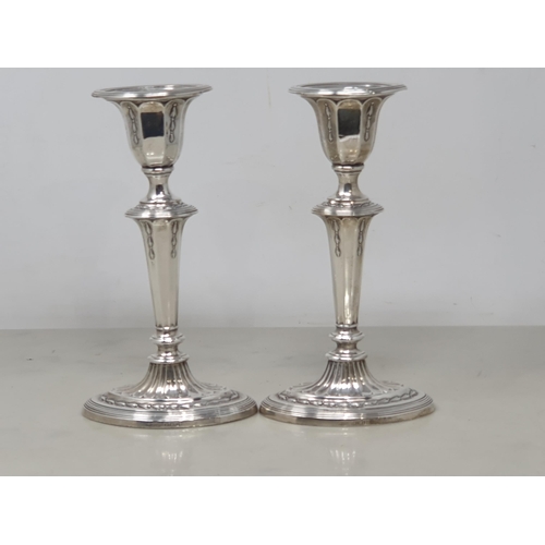 80 - A pair of George V silver Candlesticks with tapering columns on oval bases, Sheffield 1910, 6 3/4in