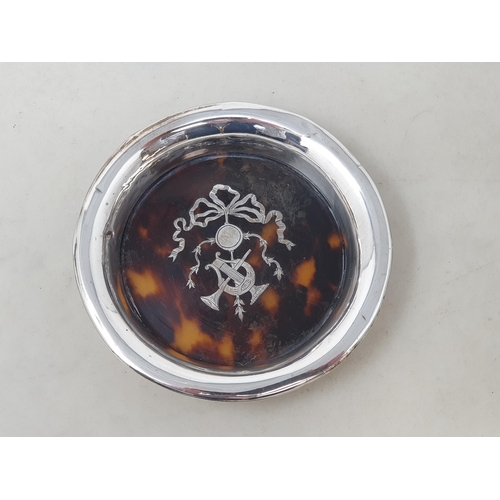 81 - A George V silver and tortoiseshell circular Dish with musical trophy and ribbon decoration, London ... 