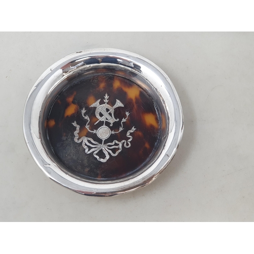 81 - A George V silver and tortoiseshell circular Dish with musical trophy and ribbon decoration, London ... 