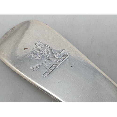 84 - A Victorian silver Basting Spoon fiddle pattern engraved crest, London 1856, 150gms