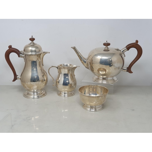 88 - A George VI silver four piece Tea Service of plain circular form, London 1945, 1980gms all in