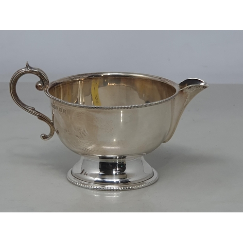 91 - A George V silver circular Jug with beaded rim, Birmingham 1931, 104gms