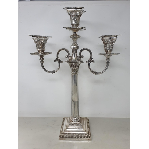 93 - A plated two branch Candelabra with leafage sconces, fluted column on stepped square base with gadro... 