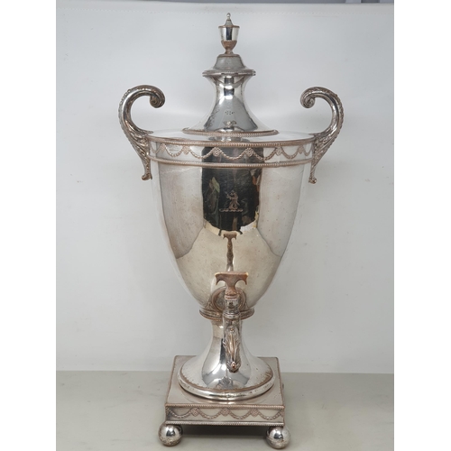 94 - A Georgian Sheffield plated Samovar of urn shape with swag frieze and engraved crest, leafage scroll... 