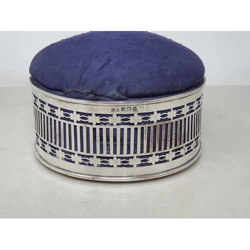 95 - A George V silver pierced circular Trinket Box with blue pin cushion lid, Birmingham 1912