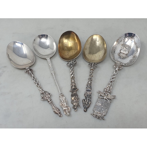 98 - Five Continental silver Spoons with ornate stems, one with import mark Sheffield 1896, 250gms