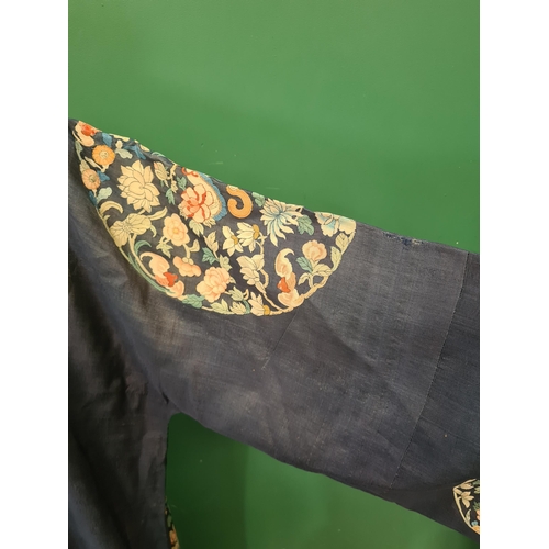 A Kossu/Kesi Robe with decoration of roundels with floral designs on a ...