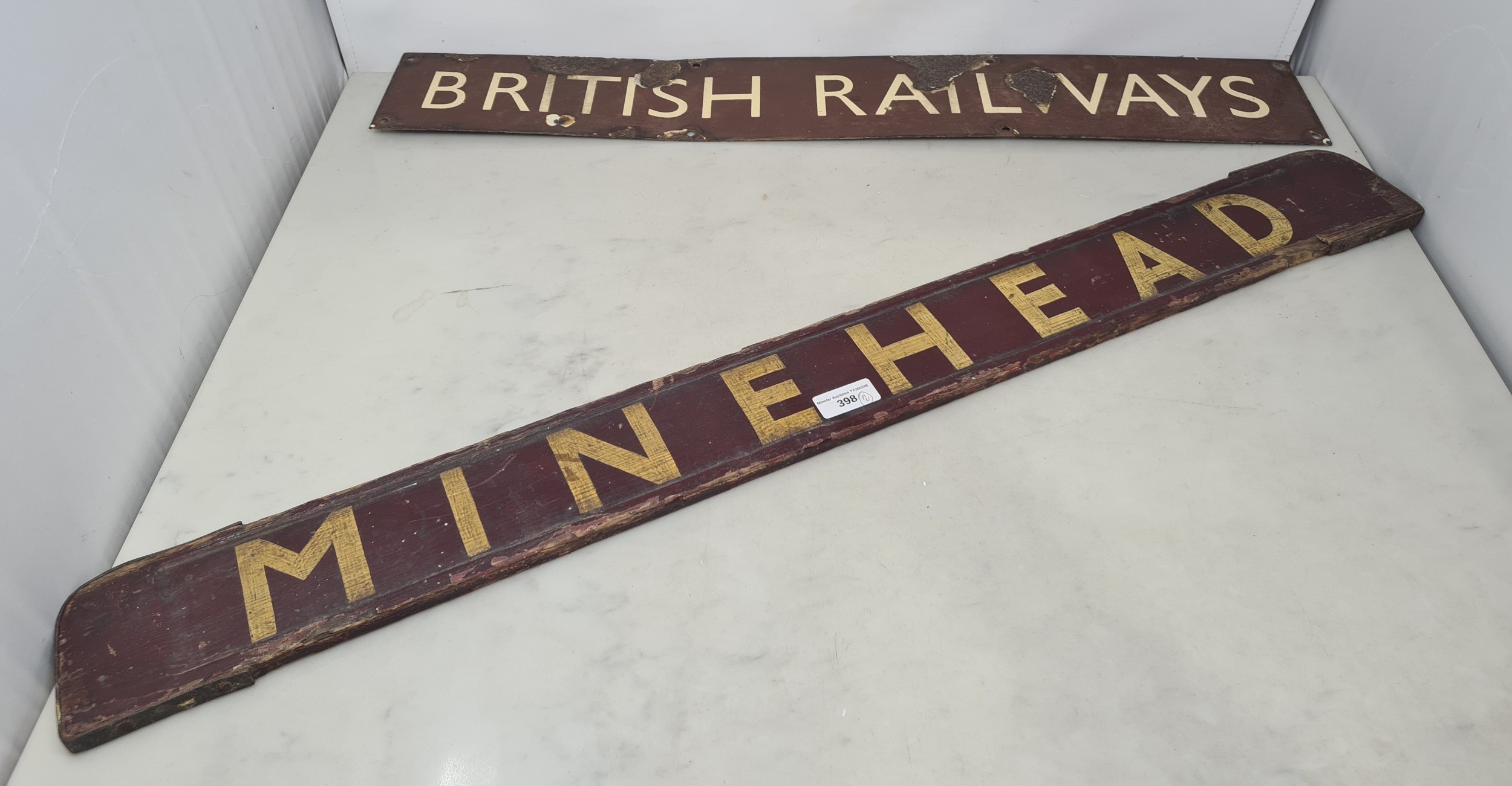 A British Railways enamel Sign and a BR (WR) wooden 'Minehead' Sign
