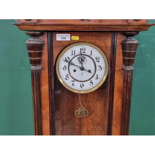 A walnut cased Vienna Wall Clock with Pagan mask surmount 3ft 8in H x ...