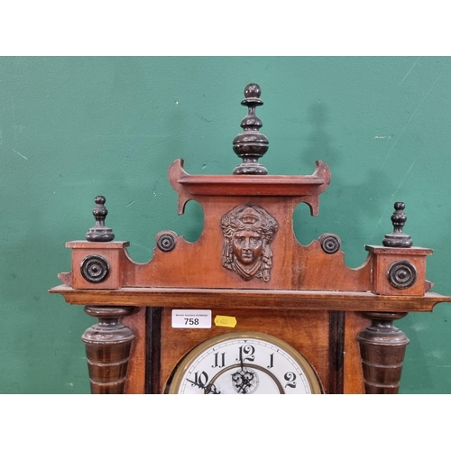 A walnut cased Vienna Wall Clock with Pagan mask surmount 3ft 8in H x ...