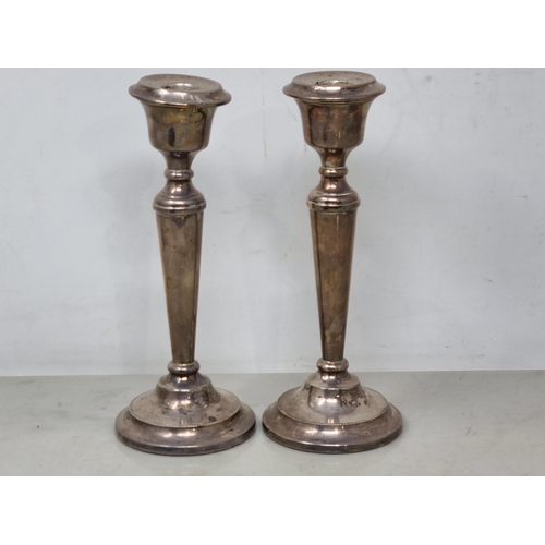 99 - A pair of Elizabeth II silver Candlesticks with tapering columns on circular bases, Birmingham 1969,... 