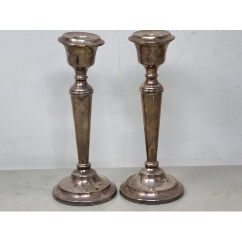 99 - A pair of Elizabeth II silver Candlesticks with tapering columns on circular bases, Birmingham 1969,... 