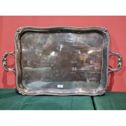 100 - A large silver plated two handled oblong Tea Tray with gadroon rim having scallop corners, 30 x 17in