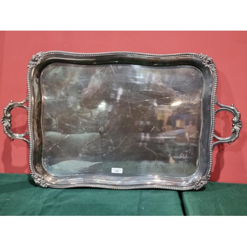 100 - A large silver plated two handled oblong Tea Tray with gadroon rim having scallop corners, 30 x 17in