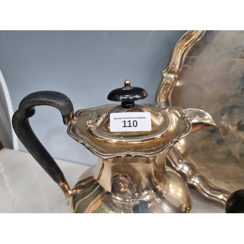 110 - Plated Items: Entree Dishes and Tea Service on a circular Tray