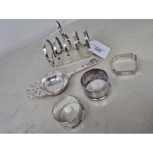 122 - A George V silver five bar Toastrack, Birmingham 1931, 80gms, two silver Napkin Rings ,another plate... 