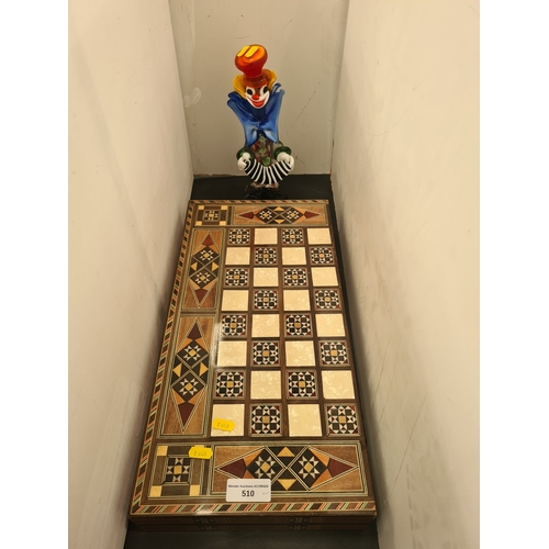 510 - A modern inlaid Backgammon Board with counters and a glass figure of a Clown, (R5)