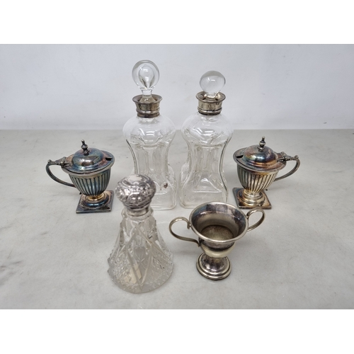 87 - A pair of George V silver mounted glass Spirit Flasks, Birmingham 1912, two silver Whisky Labels, a ... 