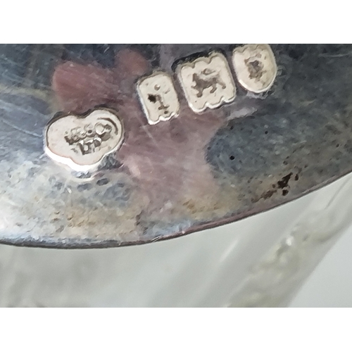 87 - A pair of George V silver mounted glass Spirit Flasks, Birmingham 1912, two silver Whisky Labels, a ... 