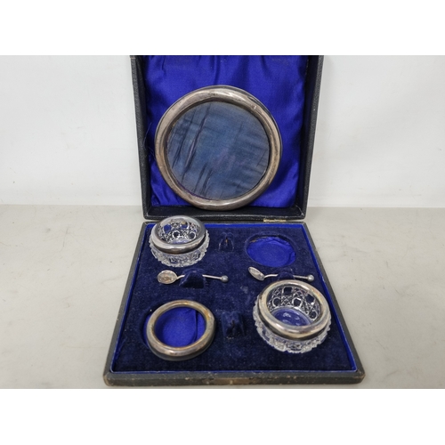 92 - Two Edward VII silver mounted glass Salts, a spare Rim, and two Spoons, Chester 1907, in case, and a... 