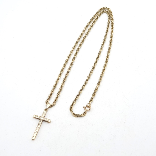 233 - A 9ct gold engraved Pendant Cross on a Prince of Wales link Chain stamped 9ct, approx 15.8gms
