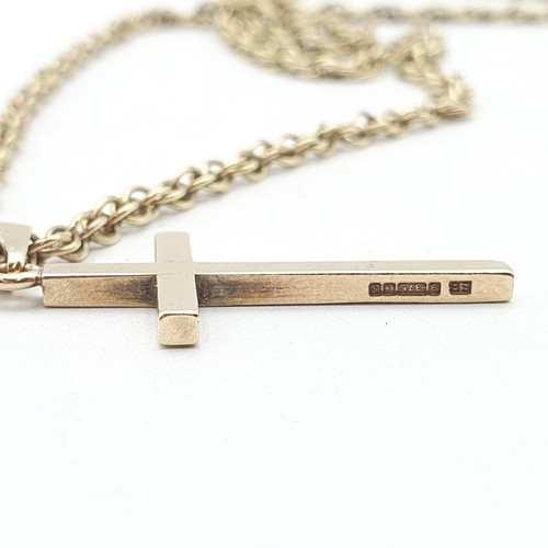 233 - A 9ct gold engraved Pendant Cross on a Prince of Wales link Chain stamped 9ct, approx 15.8gms