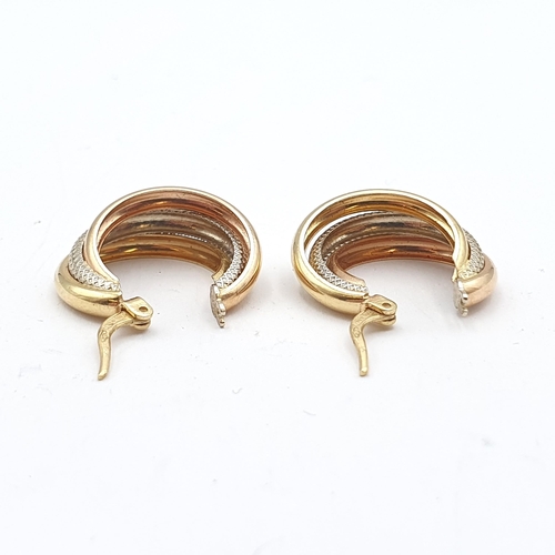 243 - A pair of three colour gold metal Hoop Earrings stamped 750, 29mm diameter, approx 3.9gms