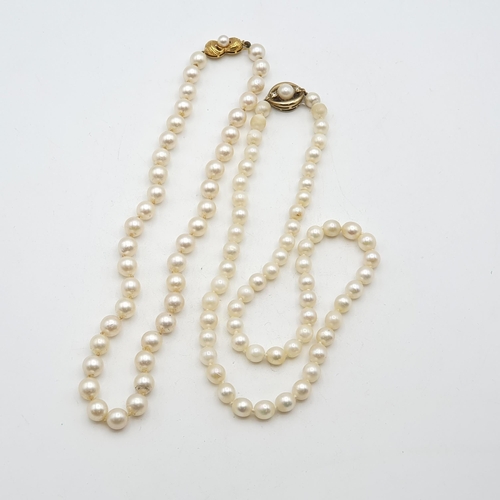 244 - Two strings of Cultured Pearls both on clasps stamped 375, one set cultured pearl and tiny diamonds ... 