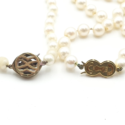 244 - Two strings of Cultured Pearls both on clasps stamped 375, one set cultured pearl and tiny diamonds ... 