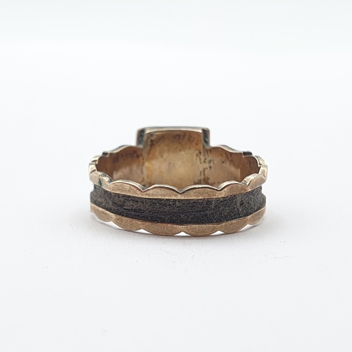 246 - A Victorian Mourning Ring with plaited hair to outside of shank and opening compartment containing l... 
