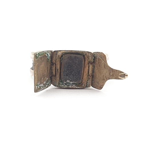 246 - A Victorian Mourning Ring with plaited hair to outside of shank and opening compartment containing l... 