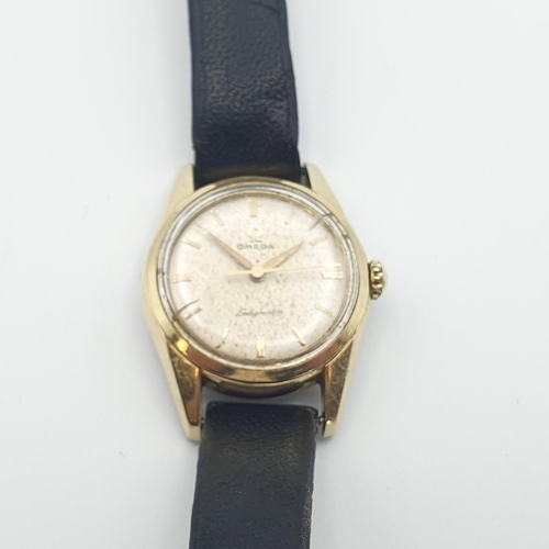 252 - OMEGA. An Omega 'Ladymatic' Seamaster Wristwatch the silvered dial with hourly baton markers in gold... 