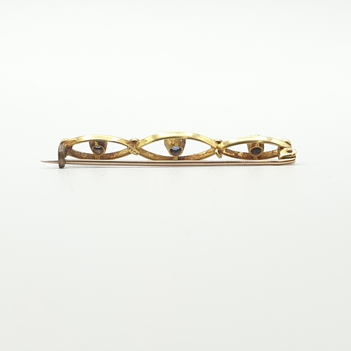 254 - An early 20th Century Sapphire and Seed Pearl Bar Brooch, stamped 15ct, approx 4.5cm wide, approx 3.... 
