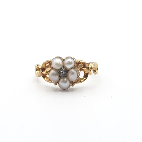 256 - A Victorian Cluster Ring set rose-cut diamond within five seed pearls, woven hair to reverse in scol... 