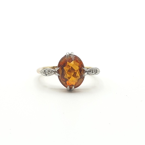 257 - A Fire Opal and Diamond Ring claw-set oval-cut fire opal between two millegrain-set eight-cut diamon... 