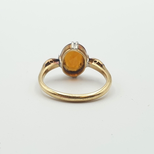 257 - A Fire Opal and Diamond Ring claw-set oval-cut fire opal between two millegrain-set eight-cut diamon... 
